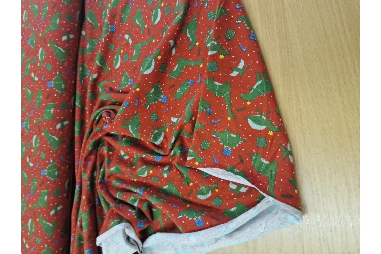 Christmas Dinos Cotton Jersey Red 95% Cotton 5% Elastane 150cm Wide